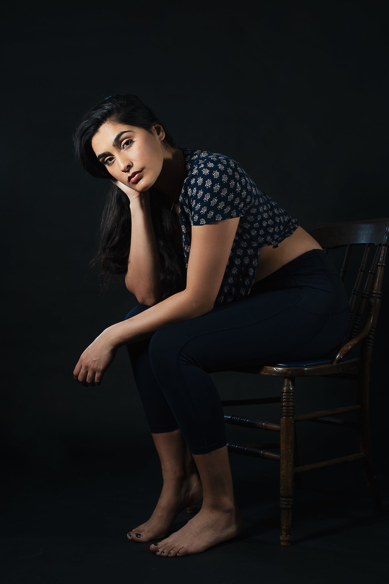 files/woman-looks-forward-while-sitting-on-wooden-chair.jpg